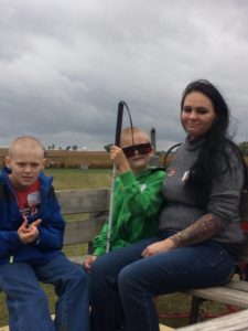 Mother and two sons on the hayride.